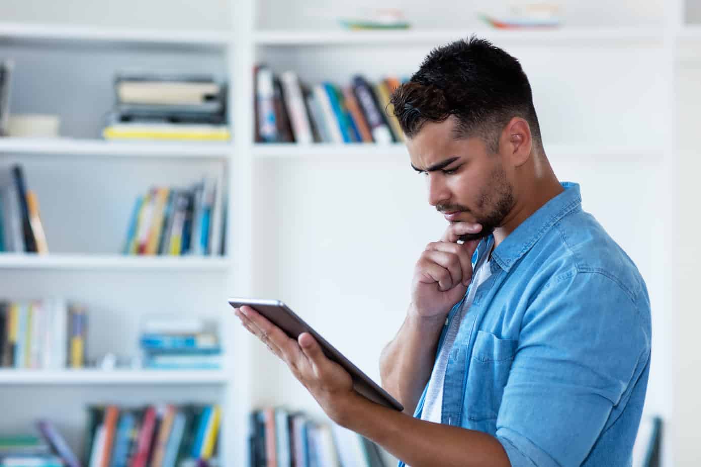 man reading an ipad