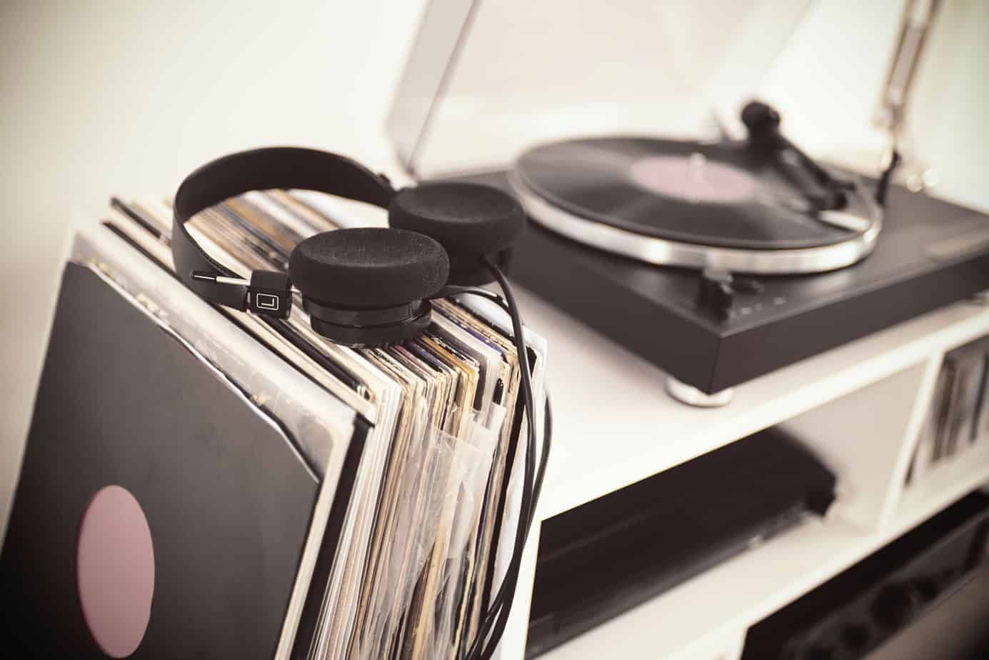 a record player and a stock of records