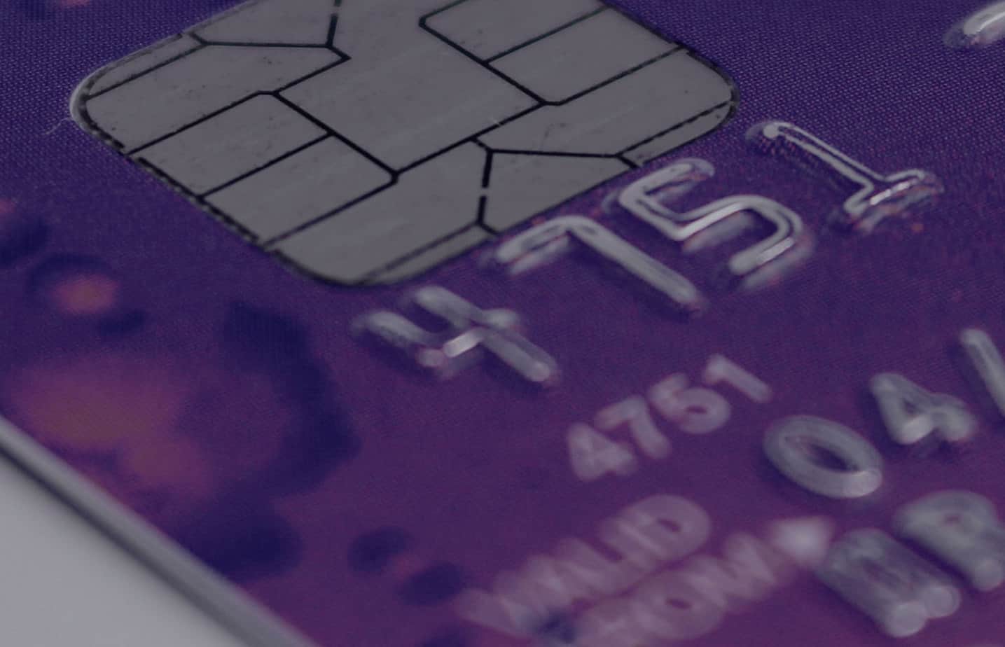 A close up image of a credit card with a chip in it.