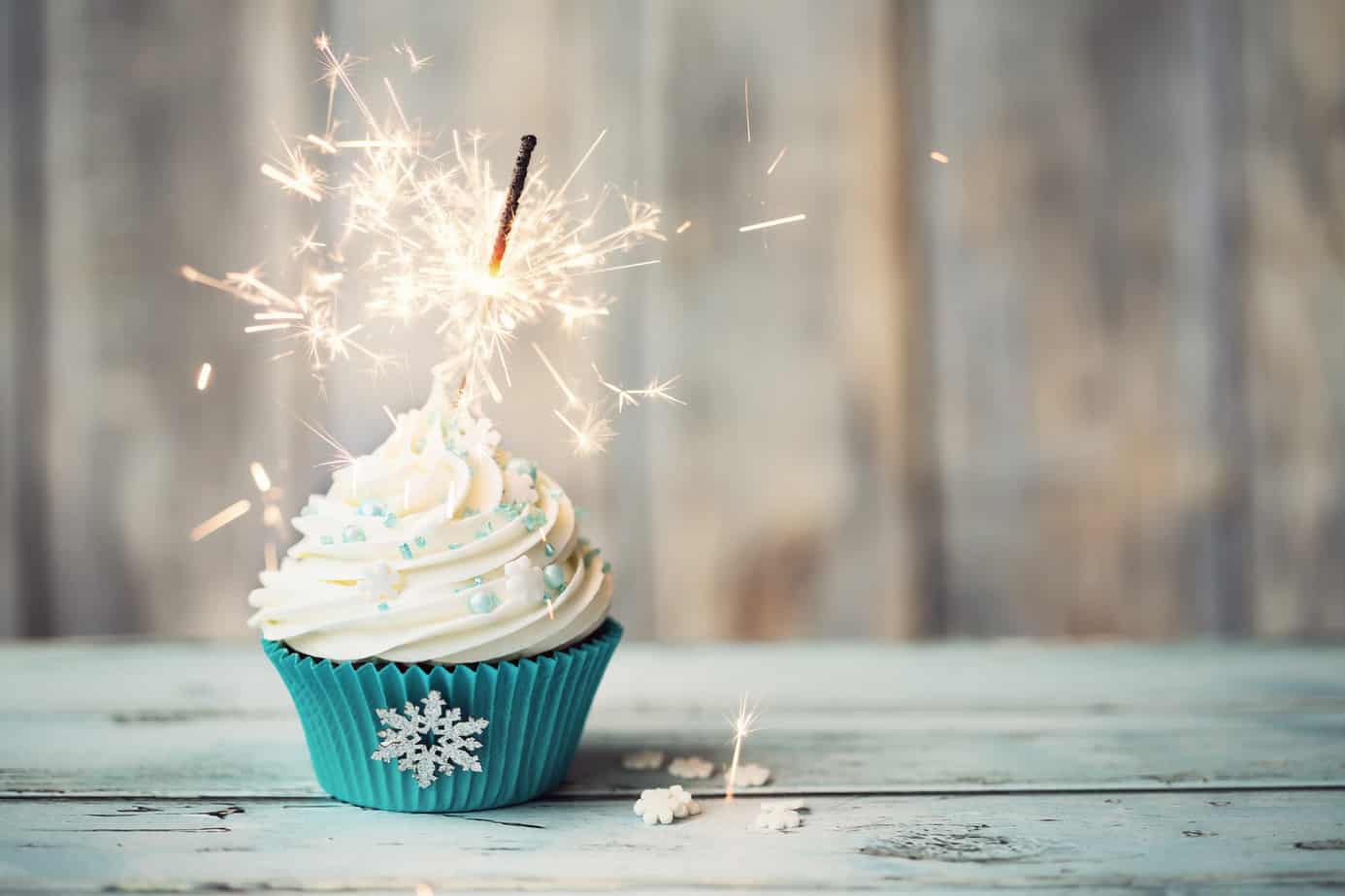 cupcake with a lit sparkler in it.