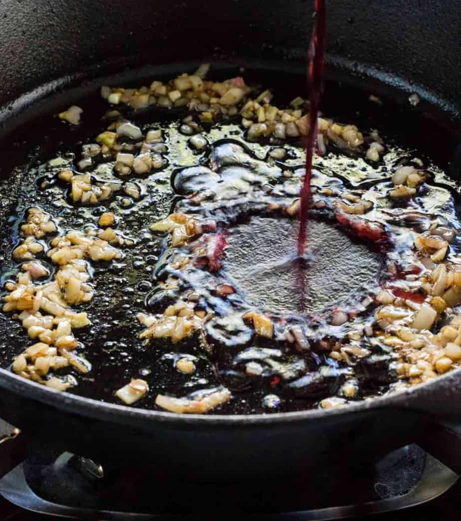 red wine reduction sauce in a cast iron pan