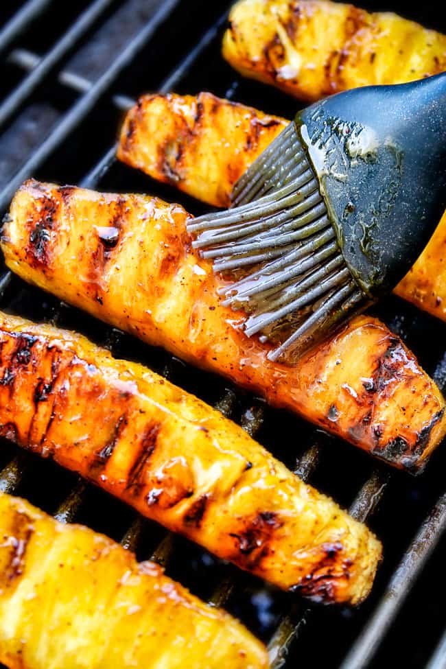 pineapple on the grill with a sticky caramelized glaze on it. The perfect grilled pineapple recipe 