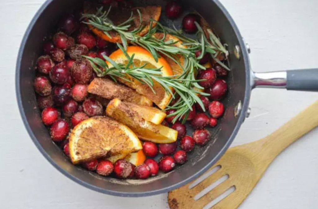 make your house smell like the holidays. Ingredients in a pot orange, cinnamon, nutmeg, rosemary, cranberries