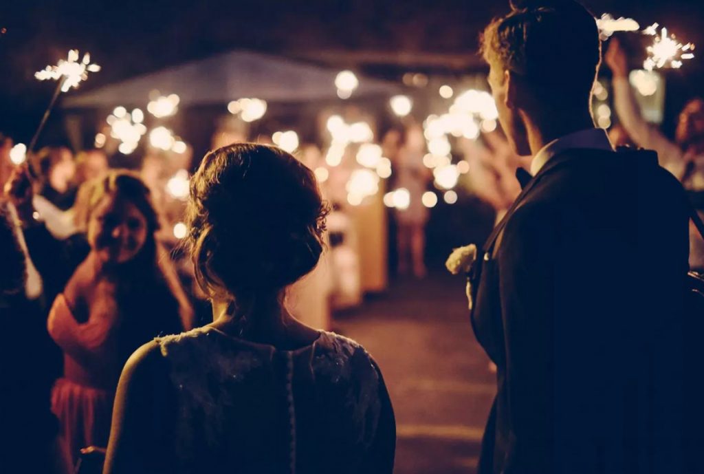 people singing at a budget friendly holiday party