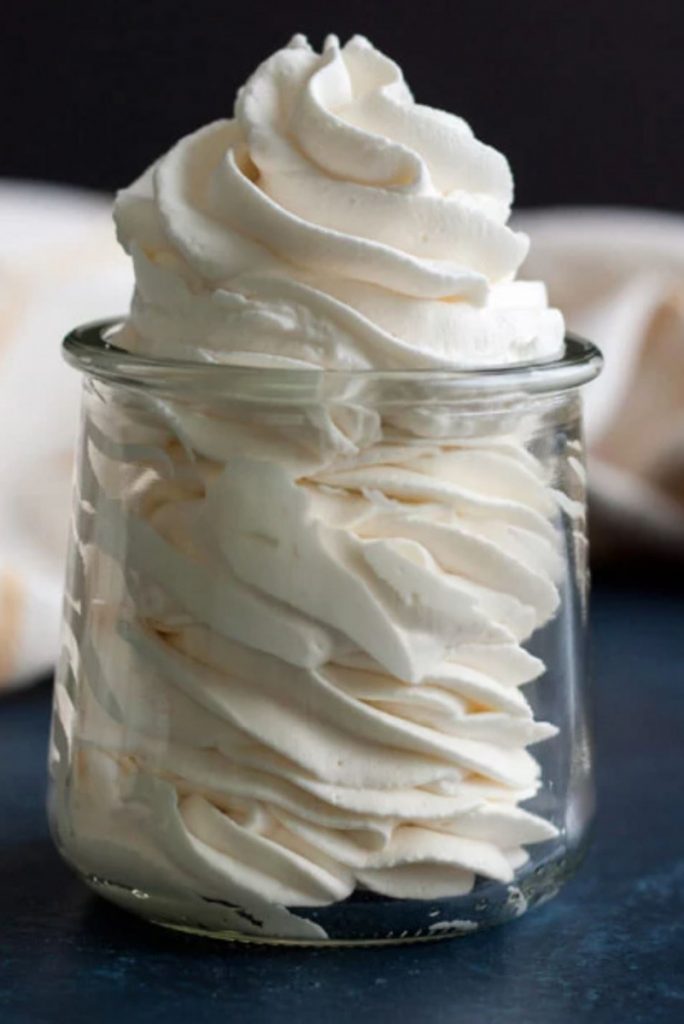 maple mascarpone whipped cream in a small glass jar