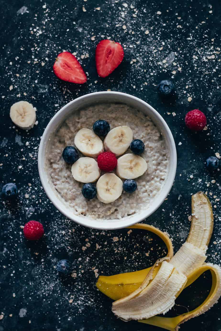 make ahead steel cut oats, topped with bananas, blueberry and raspberry.