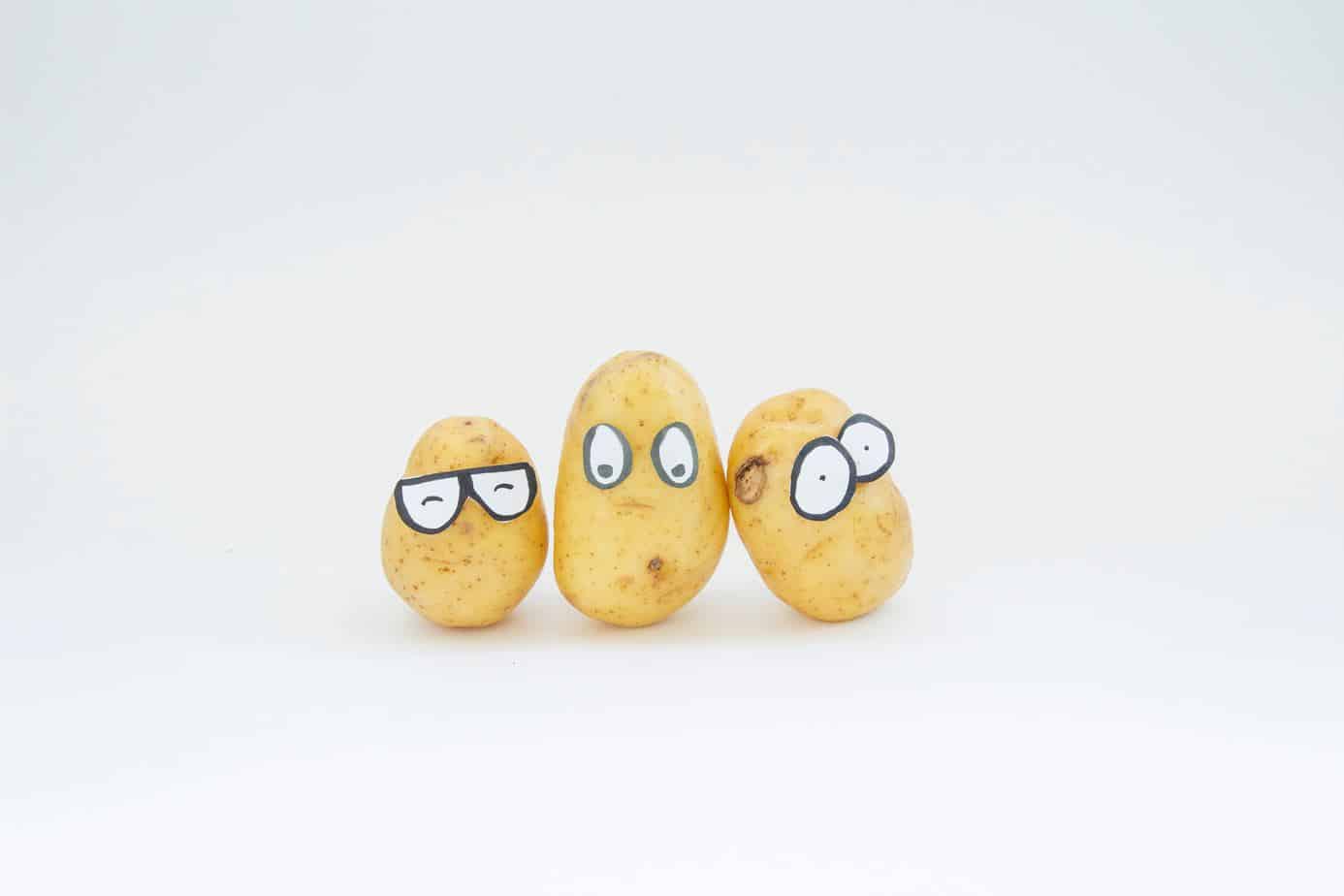 three potatoes with funny eyes on them is always a good start for how to make easy perfect potatoes.