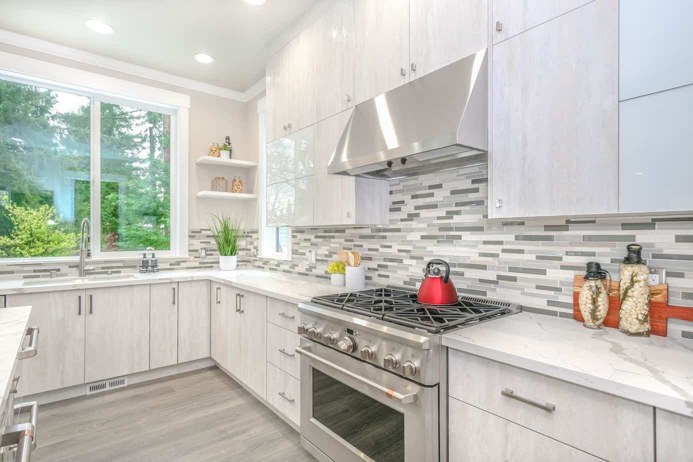 a beautiful modern home kitchen image focused on the stove and countertops.